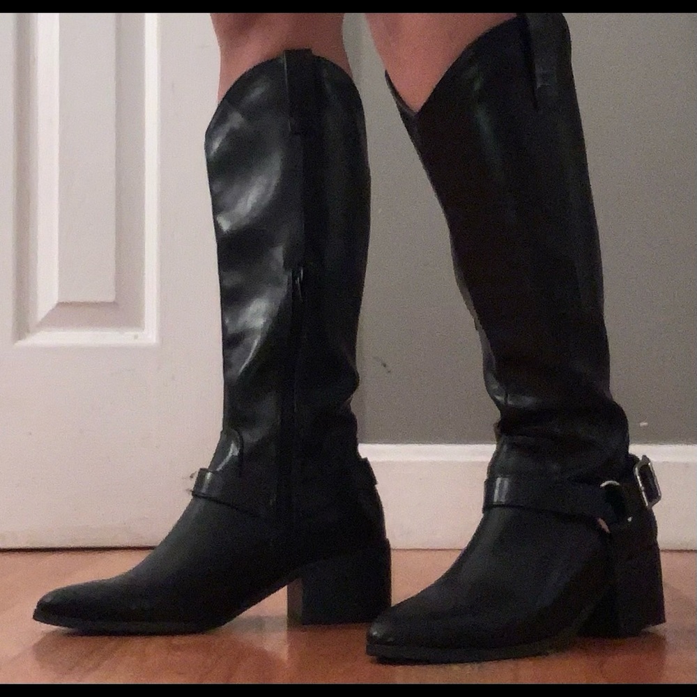 All black cowboy boots with buckle detail